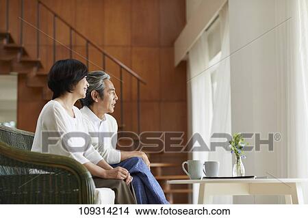 Picture - Senior Japanese couple at home. Fotosearch