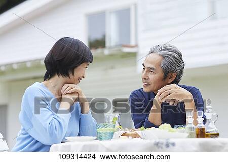 Picture - Senior Japanese couple at home. Fotosearch