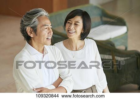 Picture - Senior Japanese couple at home. Fotosearch