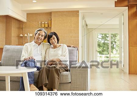 Stock Photograph - Senior Japanese couple at home. Fotosearch