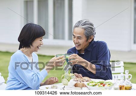 Stock Photograph - Senior Japanese couple at home. Fotosearch