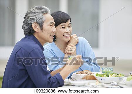 Stock Photograph - Senior Japanese couple at home. Fotosearch