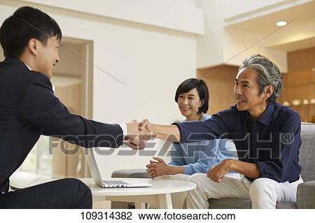 Senior Japanese couple at home with salesman View Large Photo Image Stock Image - Senior Japanese couple at home with salesman. Fotosearch