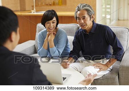 Senior Japanese couple at home with salesman View Large Photo Image Stock Photo - Senior Japanese couple at home with salesman. Fotosearch