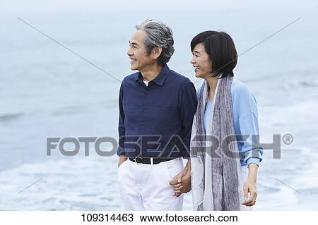 Senior Japanese couple at the beach View Large Photo Image Stock Image - Senior Japanese couple at the beach. Fotosearch