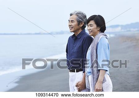 Senior Japanese couple at the beach View Large Photo Image Stock Image - Senior Japanese couple at the beach. Fotosearch