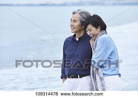 Senior Japanese couple at the beach View Large Photo Image Stock Photo - Senior Japanese couple at the beach. Fotosearch
