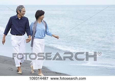 Senior Japanese couple at the beach View Large Photo Image Stock Photo - Senior Japanese couple at the beach. Fotosearch