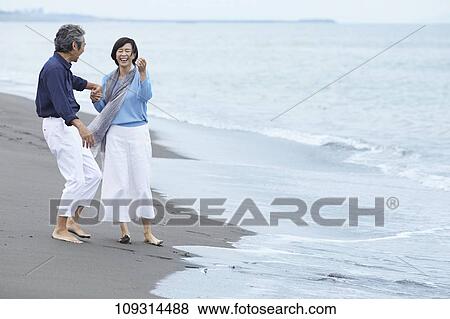 Senior Japanese couple at the beach View Large Photo Image Stock Photo - Senior Japanese couple at the beach. Fotosearch