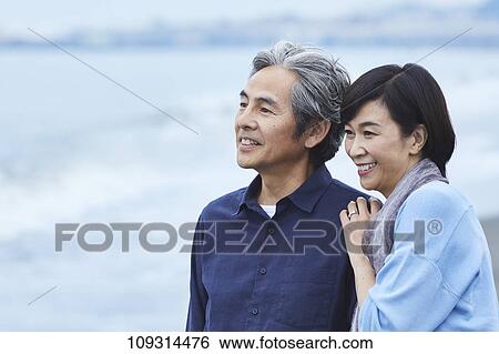 Senior Japanese couple at the beach View Large Photo Image Stock Photograph - Senior Japanese couple at the beach. Fotosearch