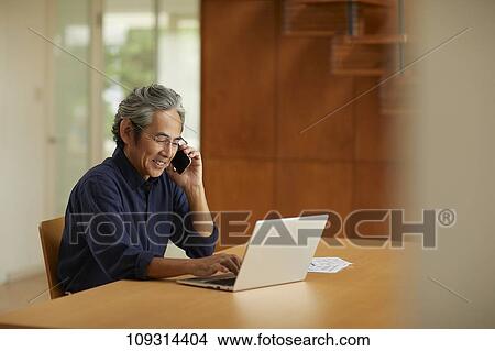 Picture - Senior Japanese man at home. Fotosearch