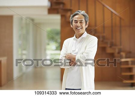Stock Image - Senior Japanese man at home. Fotosearch