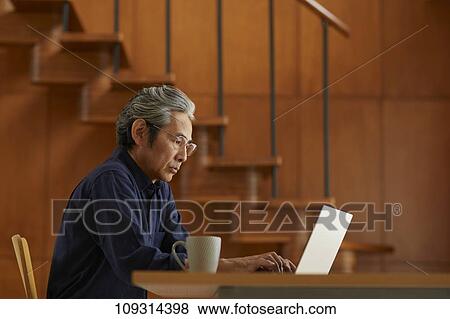 Senior Japanese man at home View Large Photo Image Stock Photo - Senior Japanese man at home. Fotosearch