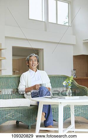 Senior Japanese man at home View Large Photo Image Stock Photo - Senior Japanese man at home. Fotosearch