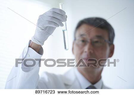 Stock Image - Senior Japanese researcher in the lab. Fotosearch
