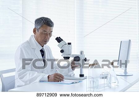 Senior Japanese researcher in the lab View Large Photo Image Stock Photo - Senior Japanese researcher in the lab. Fotosearch