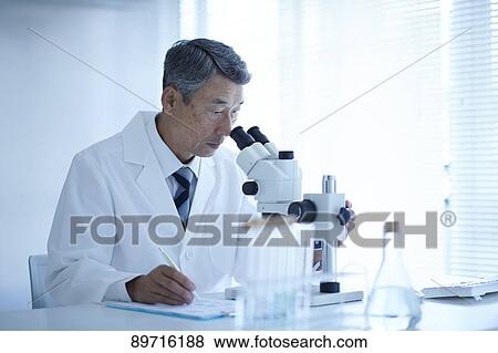 Stock Photo - Senior Japanese researcher in the lab. Fotosearch