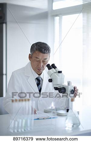 Stock Photo - Senior Japanese researcher in the lab. Fotosearch