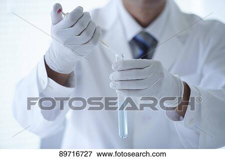 Stock Photo - Senior Japanese researcher in the lab. Fotosearch