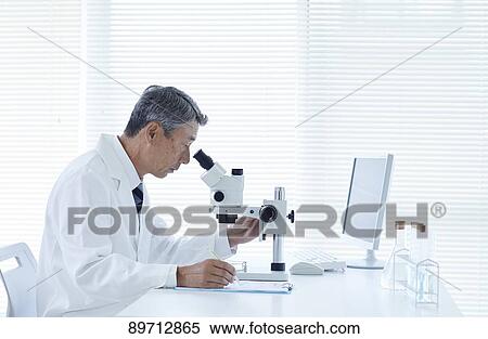 Stock Photography - Senior Japanese researcher in the lab. Fotosearch