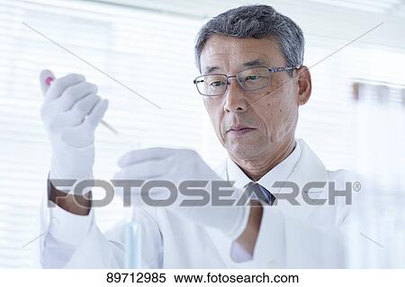 Stock Photography - Senior Japanese researcher in the lab. Fotosearch