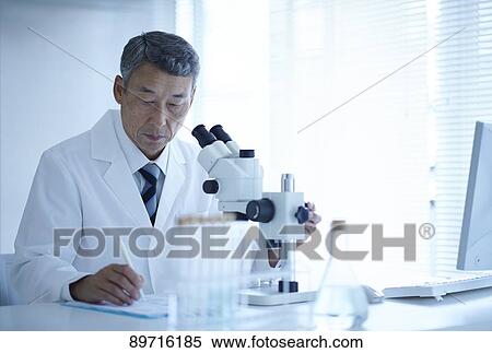 Stock Photography - Senior Japanese researcher in the lab. Fotosearch