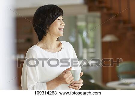 Stock Image - Senior Japanese woman at home. Fotosearch