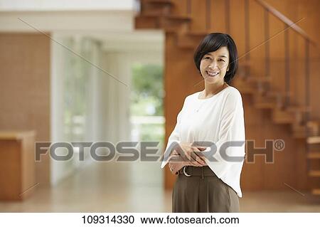 Stock Image - Senior Japanese woman at home. Fotosearch