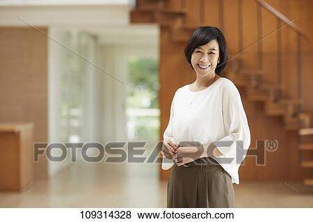 Stock Photo - Senior Japanese woman at home. Fotosearch