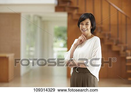 Stock Photo - Senior Japanese woman at home. Fotosearch