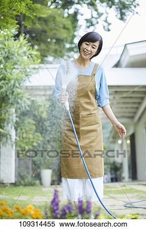 Senior Japanese woman gardening View Large Photo Image Stock Photography - Senior Japanese woman gardening. Fotosearch