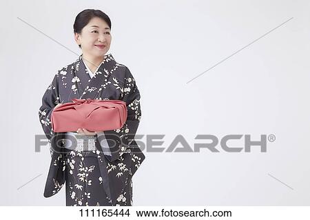 Senior Japanese woman wearing kimono View Large Photo Image Picture - Senior Japanese woman wearing kimono. Fotosearch