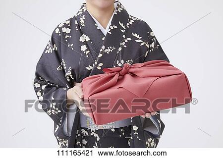 Stock Image - Senior Japanese woman wearing kimono. Fotosearch