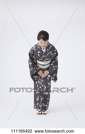 Stock Image - Senior Japanese woman wearing kimono. Fotosearch