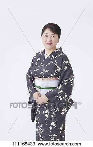 Senior Japanese woman wearing kimono View Large Photo Image Stock Image - Senior Japanese woman wearing kimono. Fotosearch