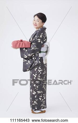 Senior Japanese woman wearing kimono View Large Photo Image Stock Image - Senior Japanese woman wearing kimono. Fotosearch