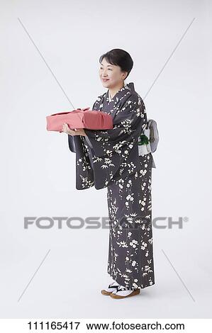 Stock Photo - Senior Japanese woman wearing kimono. Fotosearch