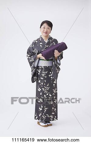 Senior Japanese woman wearing kimono View Large Photo Image Stock Photo - Senior Japanese woman wearing kimono. Fotosearch
