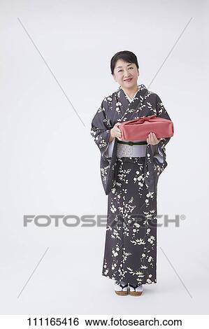 Senior Japanese woman wearing kimono View Large Photo Image Stock Photograph - Senior Japanese woman wearing kimono. Fotosearch