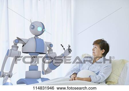 Senior Japanese woman with robot View Large Photo Image Stock Photograph - Senior Japanese woman with robot. Fotosearch