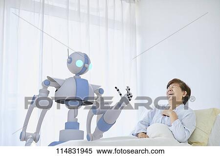Senior Japanese woman with robot View Large Photo Image Stock Photography - Senior Japanese woman with robot. Fotosearch