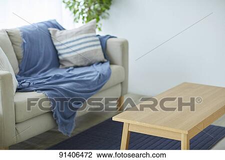 Stock Image - Side table and sofa. Fotosearch