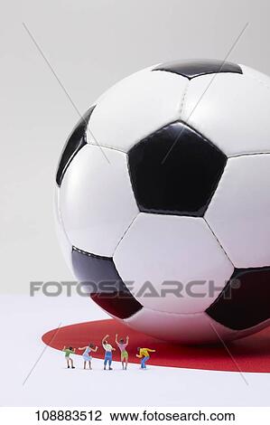 Stock Image - Sporting equipment and miniatures. Fotosearch