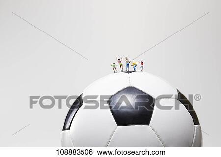 Stock Photograph - Sporting equipment and miniatures. Fotosearch
