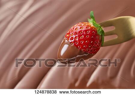 Stock Photo - Strawberry on chocolate. Fotosearch