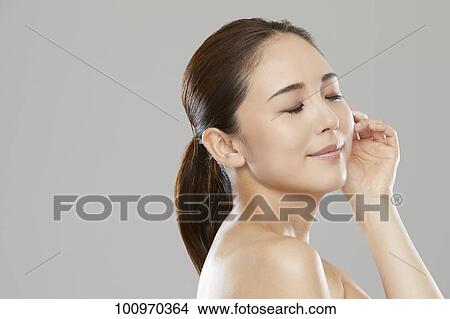 Picture - Studio portrait of attractive young Japanese woman. Fotosearch
