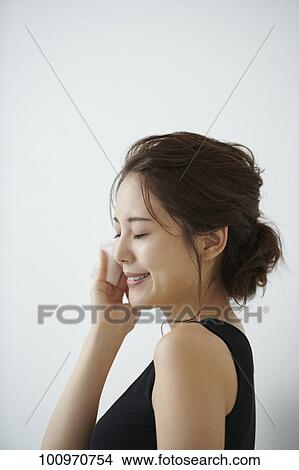 Picture - Studio portrait of attractive young Japanese woman. Fotosearch