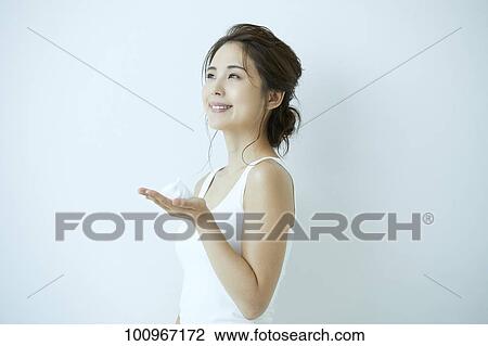 Studio portrait of attractive young Japanese woman View Large Photo Image Stock Image - Studio portrait of attractive young Japanese woman. Fotosearch