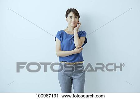 Studio portrait of attractive young Japanese woman View Large Photo Image Stock Image - Studio portrait of attractive young Japanese woman. Fotosearch