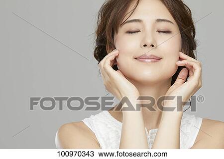 Studio portrait of attractive young Japanese woman View Large Photo Image Stock Image - Studio portrait of attractive young Japanese woman. Fotosearch